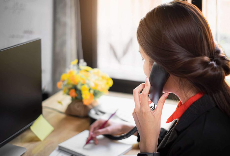 business-woman-note-schedule-book-talking-with-customer-by-telephone-1-scaled.jpg